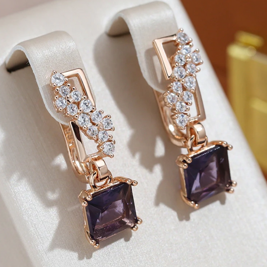 Elegant earrings with sparkling, gilded dark crystals