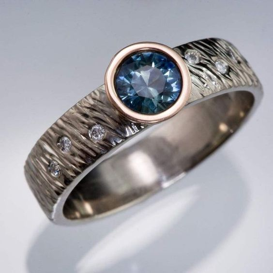 Elegant vintage ring with a radiant blue crystal