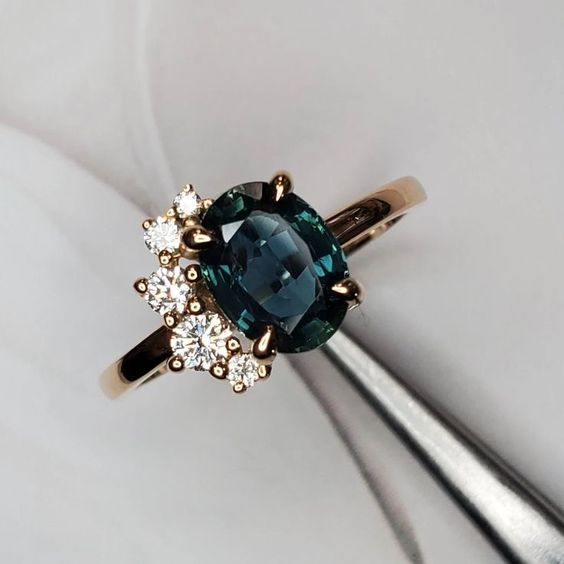 Elegant vintage ring with radiant blue crystal and sparkling zirconia stones