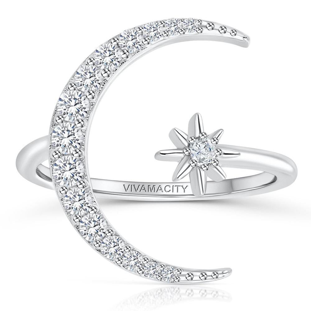 Sparkling ring with silver moon and star design