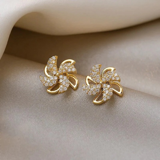 Glamorous Golden Pinwheel Earrings with Sparkling Zirconia Stones