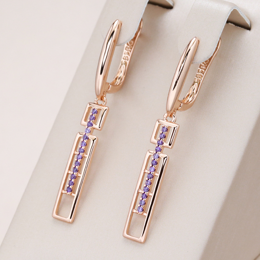 Stylish rectangular earrings with sparkling purple crystals in elegant gold design