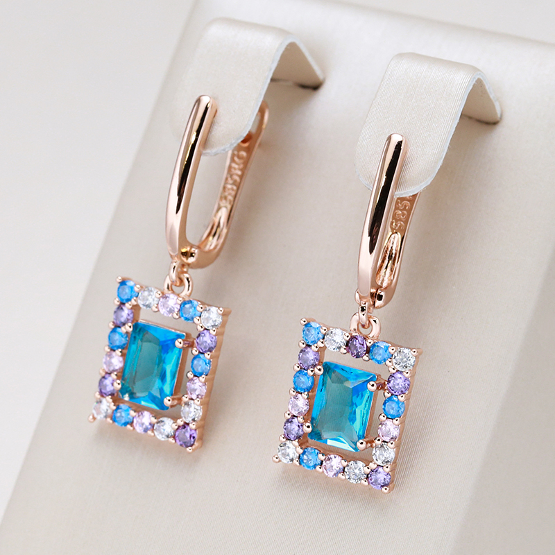 Stylish gold earrings with sparkling blue cubic crystal