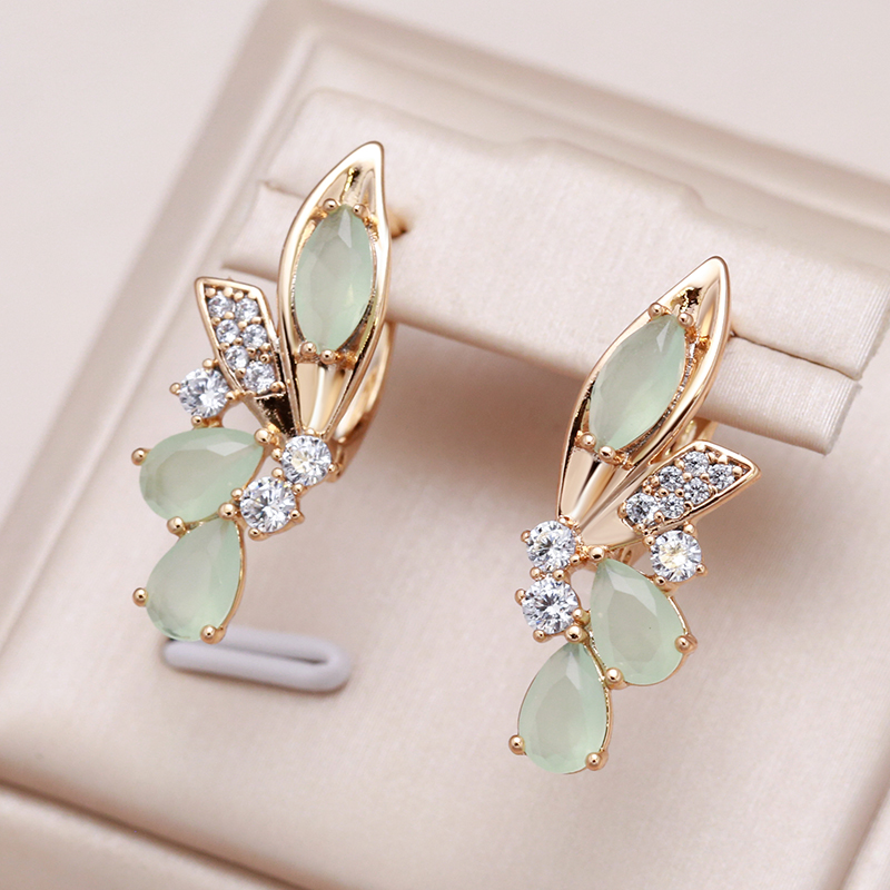 Chic Shades of Green: Gold Earrings with Sparkling Crystals and Elegant Wing Design