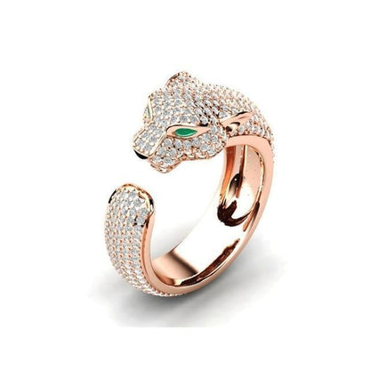 Elegant adjustable jaguar ring made of 18K silver and shiny 18K rose gold, adorned with sparkling green zirconia eyes