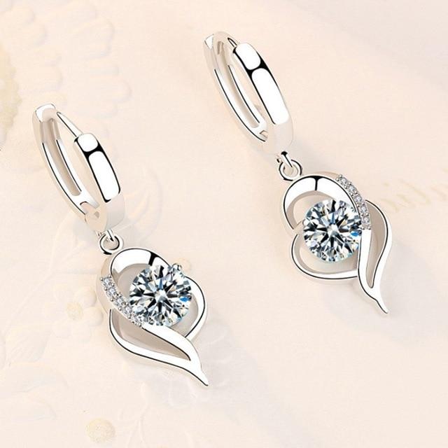 Shiny silver earrings with sparkling zirconia stones